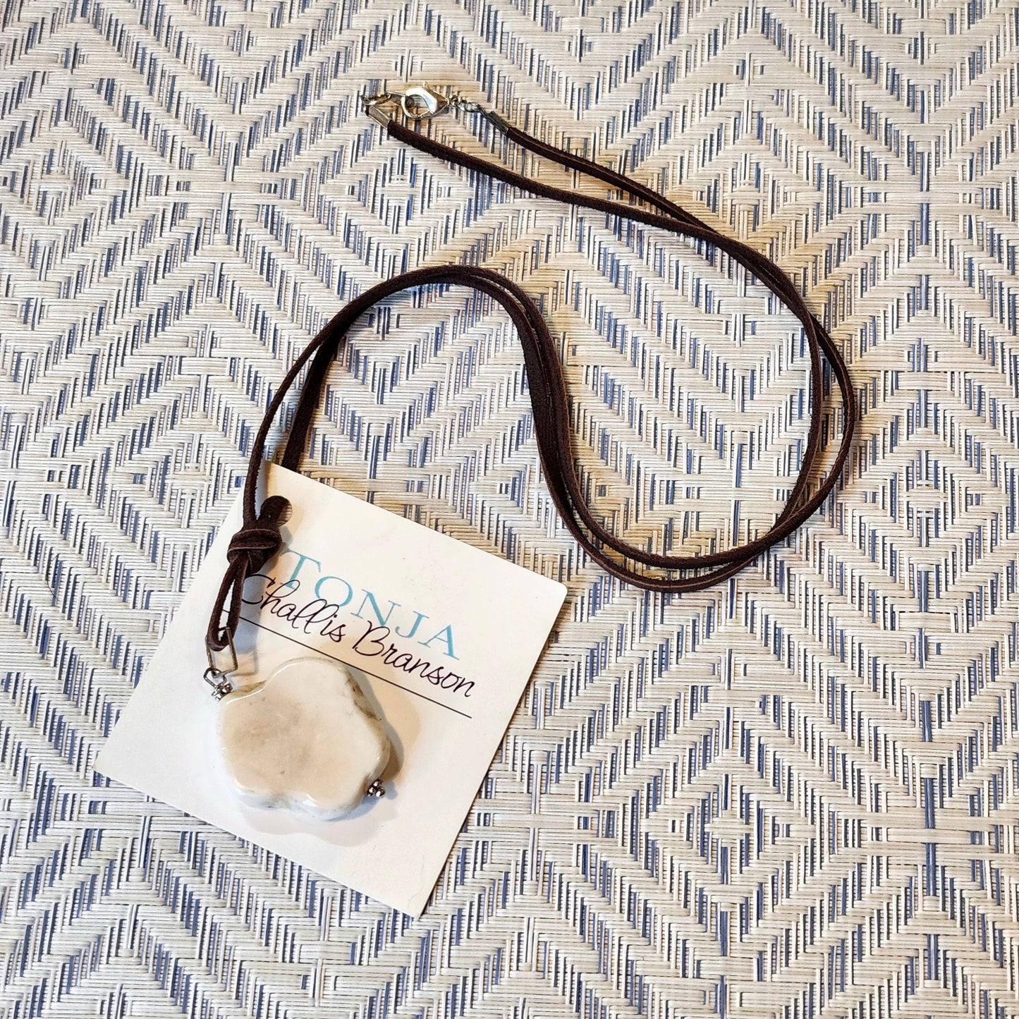 White Buffalo Stone on Chocolate Leather Necklace