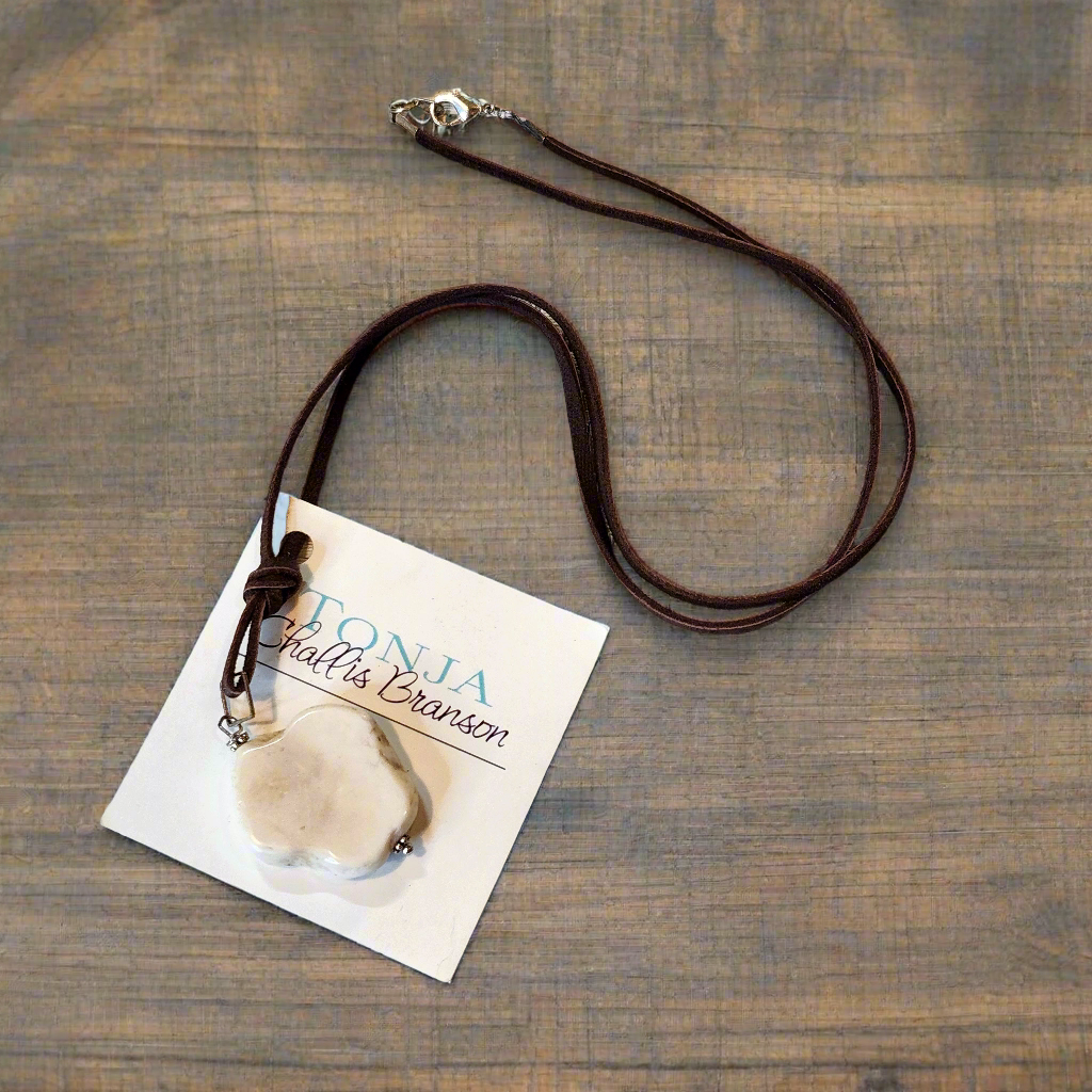 White Buffalo Stone on Chocolate Leather Necklace